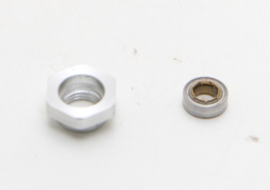 Гайка с подшипником shimano stella 14 2500s деталь на схеме 25,26